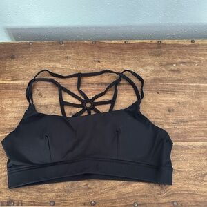 Beautiful sports bra, with spider like straps. Size 2XL NEVER WORN
